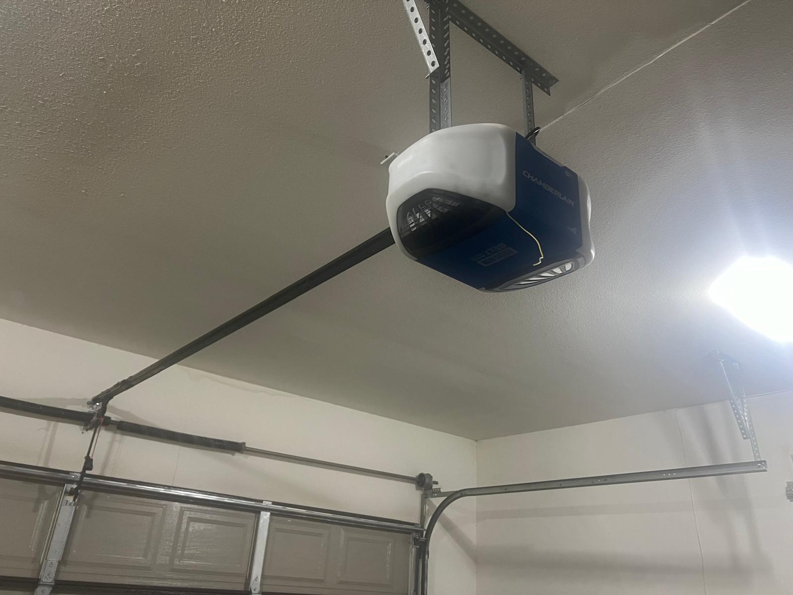 Chamberlain garage door opener mounted to a garage ceiling